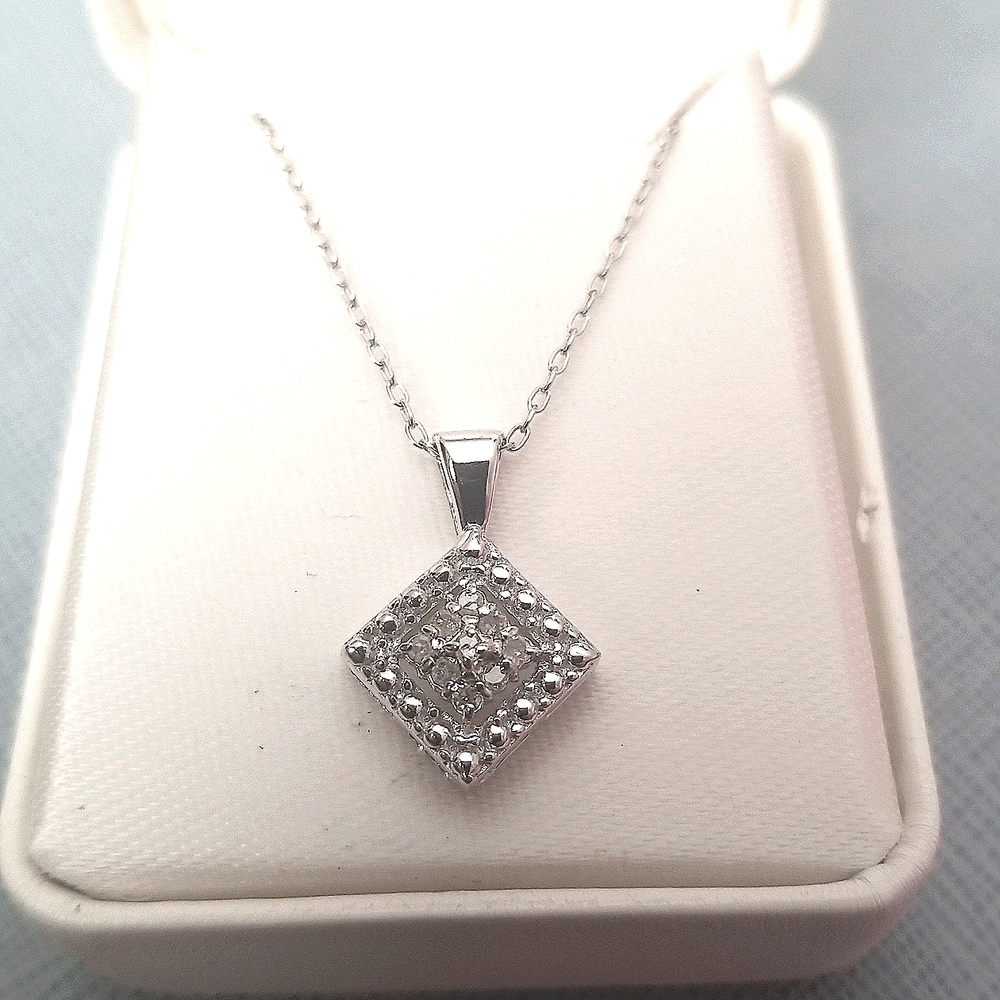 1/10 carat diamond silver sterling necklace. Never been used, still in the box!